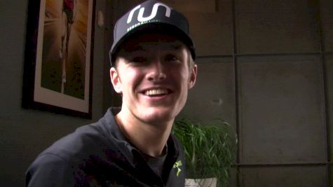 Lewis Kent shows off his new Brooks beer mile shoes