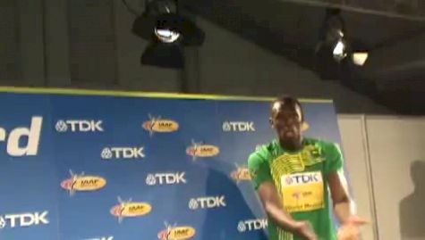 Usain getting photoed and autos