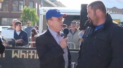 Larry Rawson talks to recovering Christian Cantwell at 2011 KU Relays Street Shot