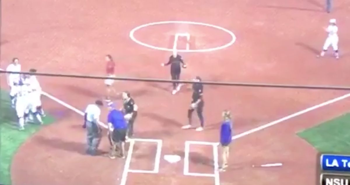 Softball Umpire, Knocked Over By Slide, Calls Runner Safe