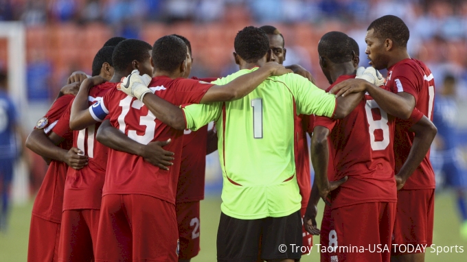 Belize players huddle before a match