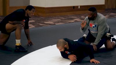 Kevin Jackson Works With J'den Cox On Leg Laces