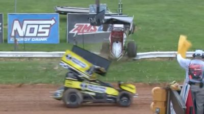 Sprint Car Crashes, Jumps Guardrail And Almost Takes Out Trophy