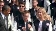 Olympic and Paralympic flagbearers, US Navy Lt. Brad Snyder and Mariel Zagunis, present the Olympic flag to President Obama