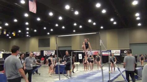 Maddy Stover rocks bar dismount