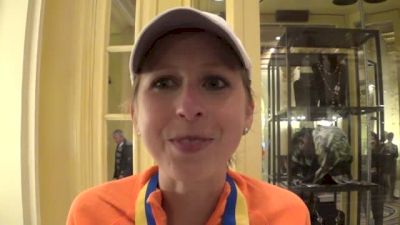 Hilary Dionne after finishing 15th, holding Meb's hand