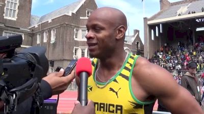 Asafa Powell addresses the media after 400m relay