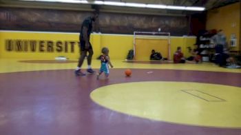 Jordan Burroughs playing ball with his son Beacon